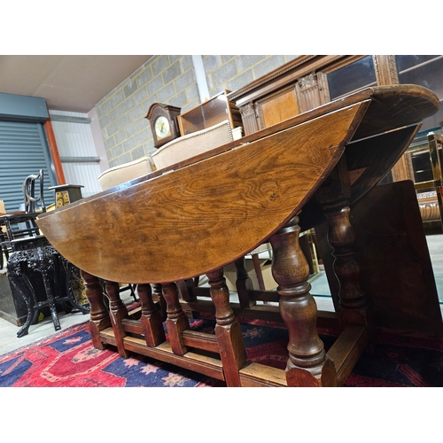 51 - Large antique drop leaf oak table