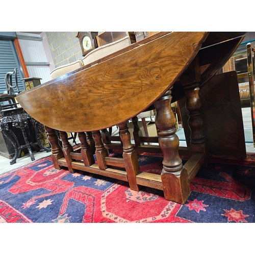 51 - Large antique drop leaf oak table