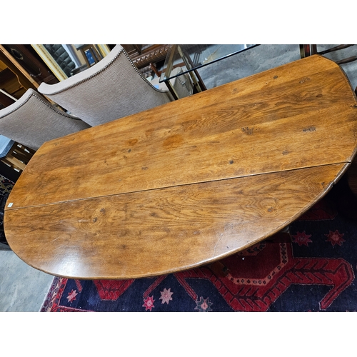 51 - Large antique drop leaf oak table