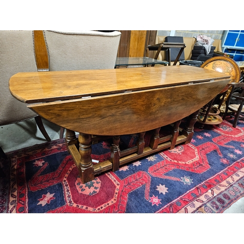 51 - Large antique drop leaf oak table