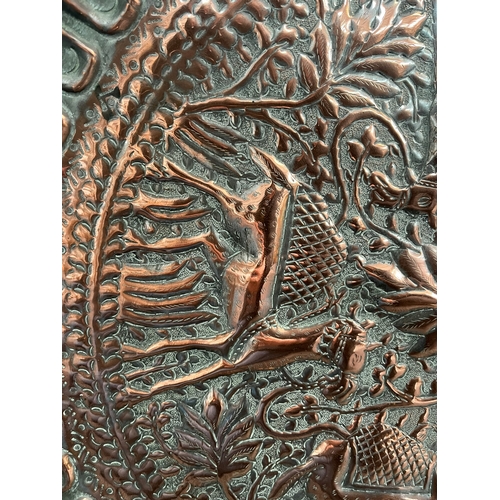 219 - Large antique copper tray decorated with camels