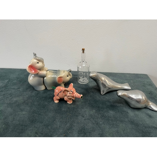 261 - Various items, elephant salt and pepper, glass bottle, aluminum animals etc.