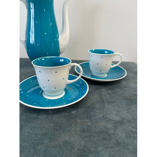 320 - Susie Cooper blue and white polka dot teapot, two cups and saucers and spare saucers