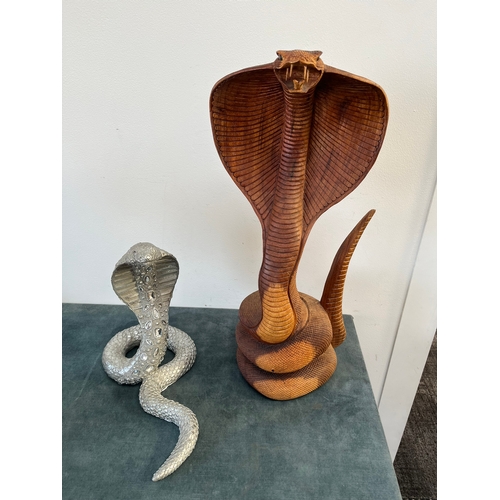 160 - Pair of snakes - One silver and one carved wood