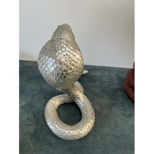 160 - Pair of snakes - One silver and one carved wood