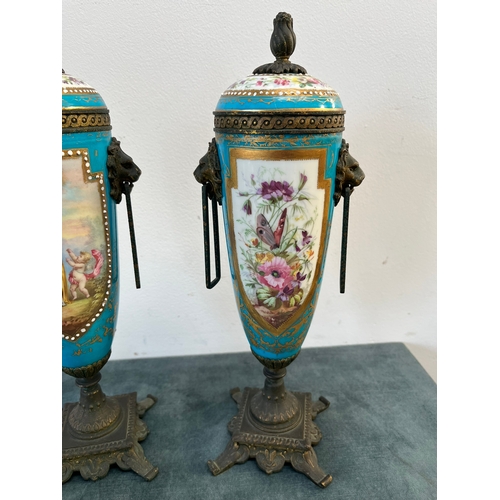 162 - Pair of French decorated urns with lion brass handles