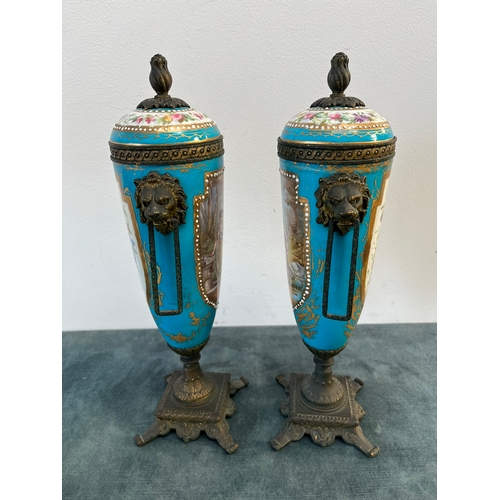 162 - Pair of French decorated urns with lion brass handles