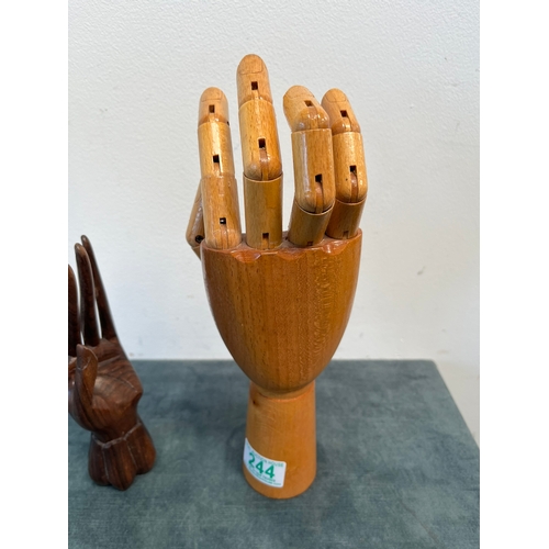 244 - Vintage hand mannequin and one other wooden hand