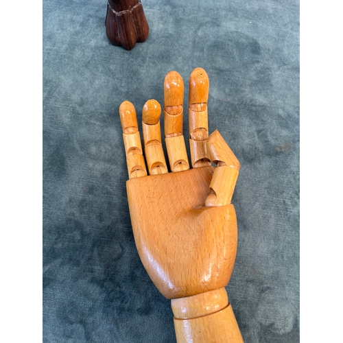 244 - Vintage hand mannequin and one other wooden hand