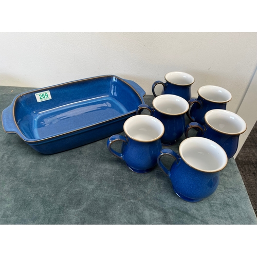 269 - Denby blue baking dish and six Denby mugs