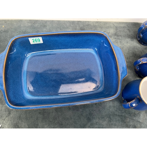 269 - Denby blue baking dish and six Denby mugs