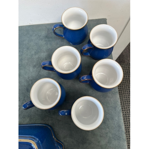 269 - Denby blue baking dish and six Denby mugs