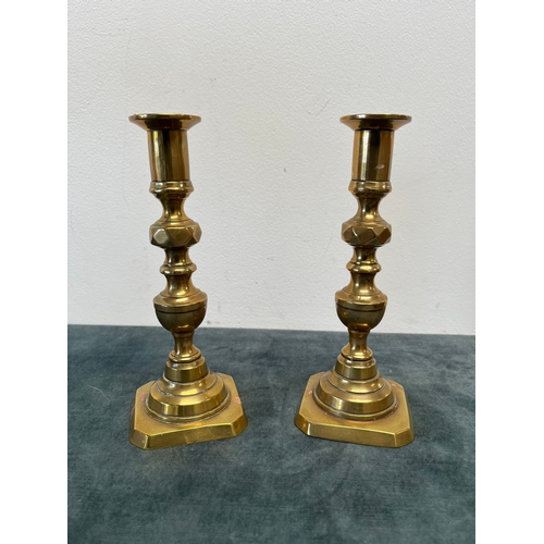 271 - Pair of antique brass candlesticks