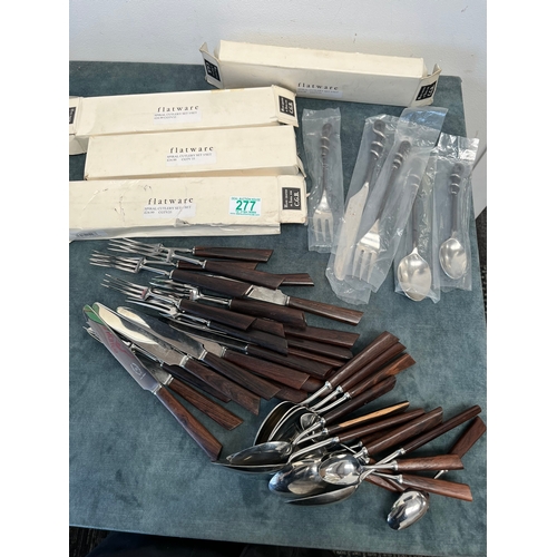 277 - Set of spiral cutlery and selection of retro wood handle cutlery