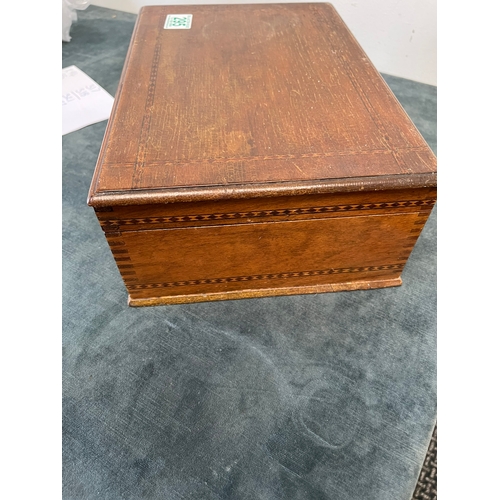 295 - Wooden box with inlay and a part chess set