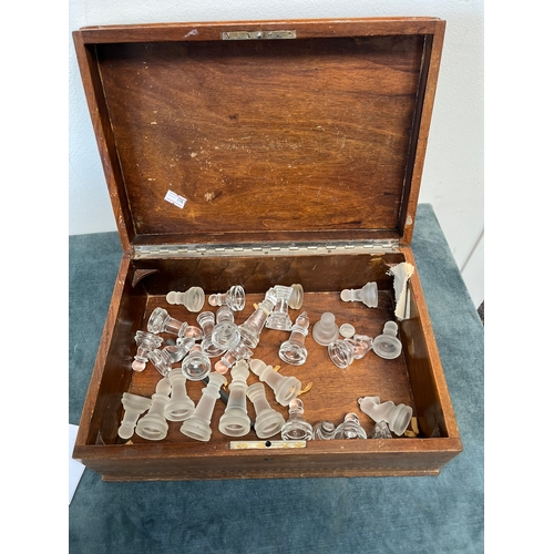 295 - Wooden box with inlay and a part chess set