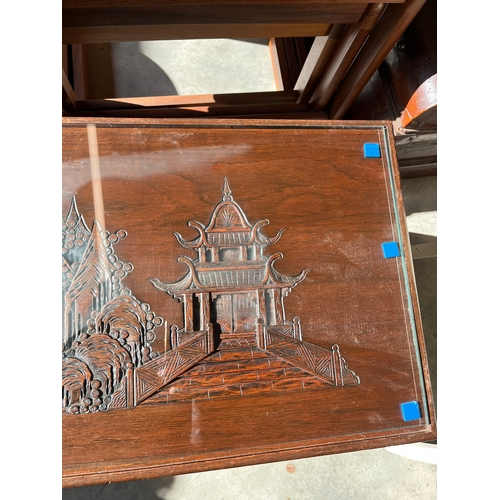 17 - Oriental coffee table carved with glass top