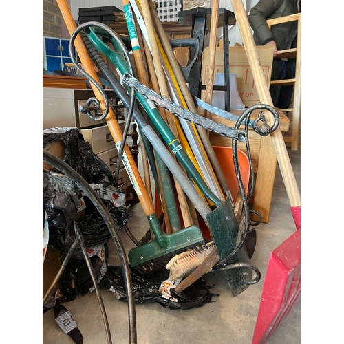 69 - 2 x Metal log holders. (not including garden tools)