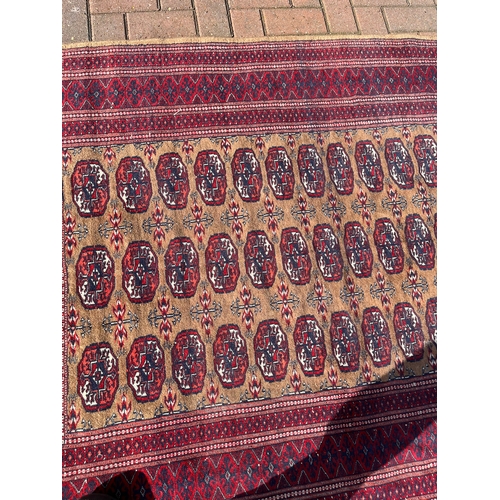 82 - Persian Bokhara rug 

130cm x 190cm