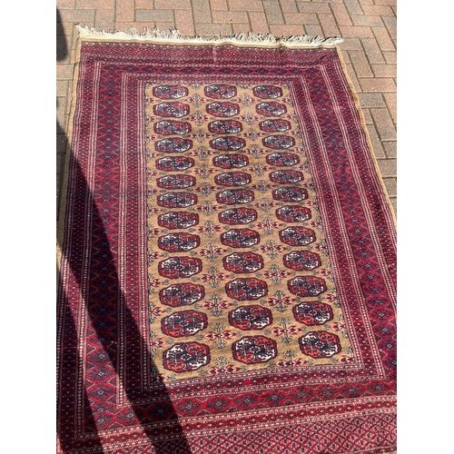 82 - Persian Bokhara rug 

130cm x 190cm