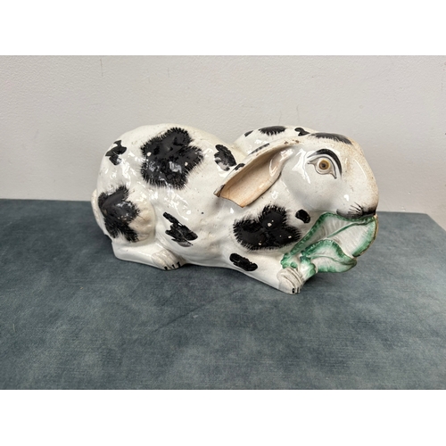 Antique Staffordshire pottery rabbit nibbling leaves