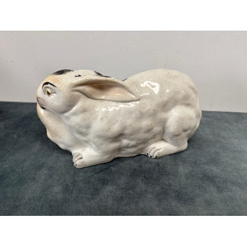Antique Staffordshire pottery rabbit nibbling leaves