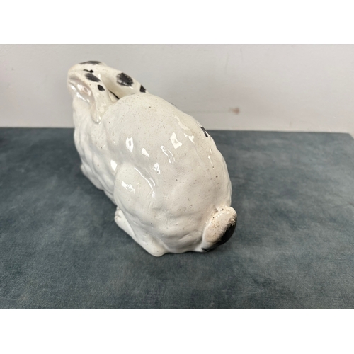 Antique Staffordshire pottery rabbit nibbling leaves