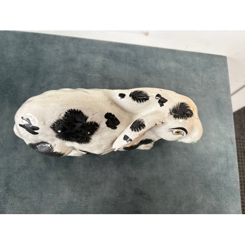 Antique Staffordshire pottery rabbit nibbling leaves