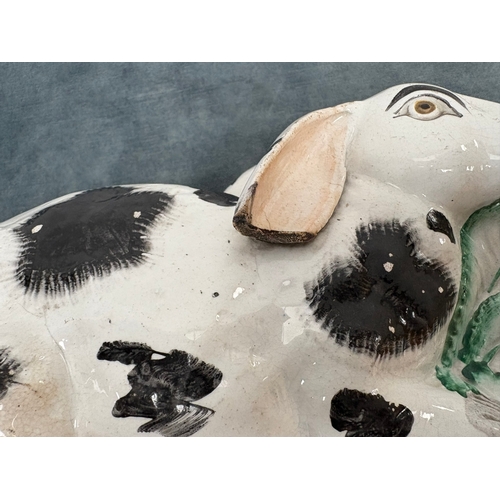 Antique Staffordshire pottery rabbit nibbling leaves