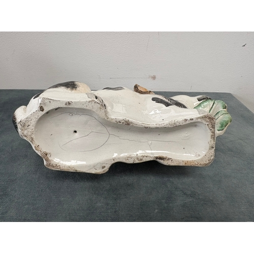 Antique Staffordshire pottery rabbit nibbling leaves