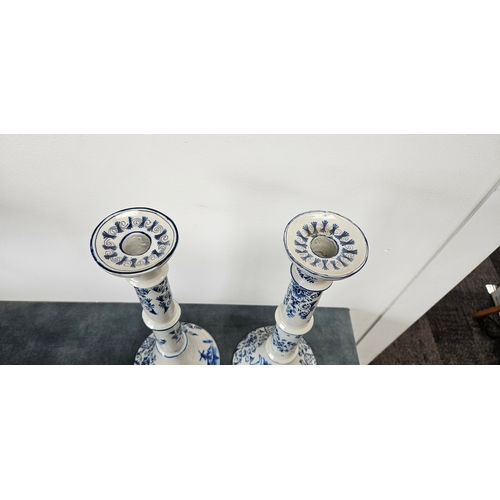216 - Large pair of Dutch Delft blue and white porcelain candlesticks
