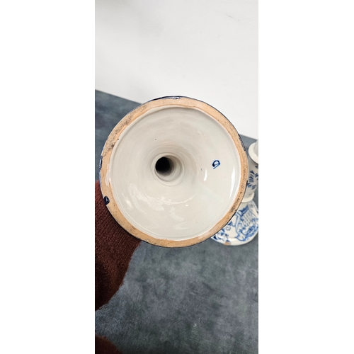 216 - Large pair of Dutch Delft blue and white porcelain candlesticks