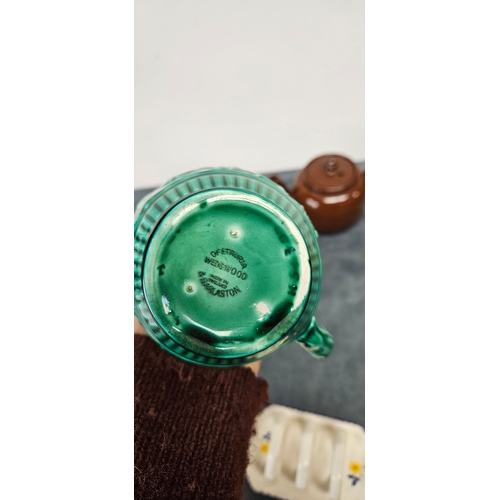 277 - Brown pottery teapot and Wedgwood Majolica green hunting scene jug