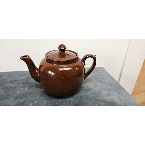 277 - Brown pottery teapot and Wedgwood Majolica green hunting scene jug