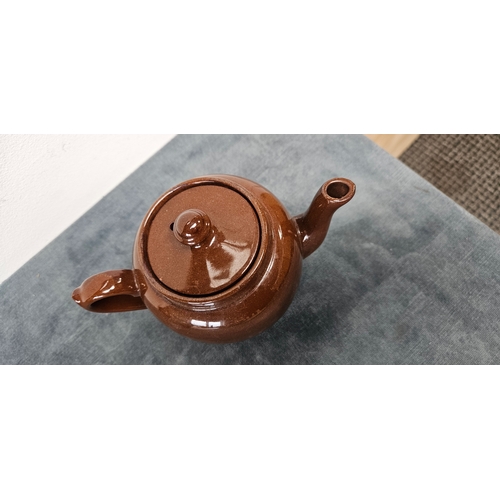 277 - Brown pottery teapot and Wedgwood Majolica green hunting scene jug