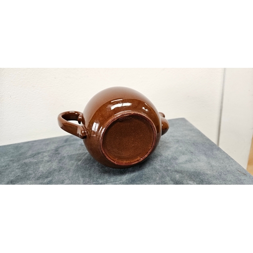 277 - Brown pottery teapot and Wedgwood Majolica green hunting scene jug