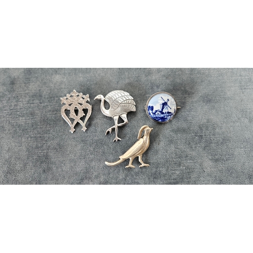 562 - 4 x Silver brooches including delft and birds