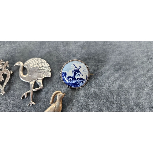 562 - 4 x Silver brooches including delft and birds
