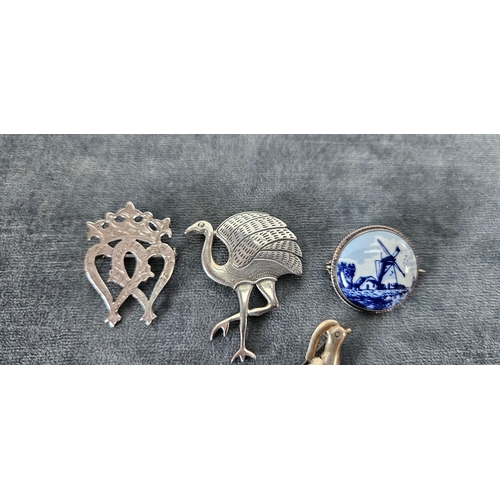 562 - 4 x Silver brooches including delft and birds