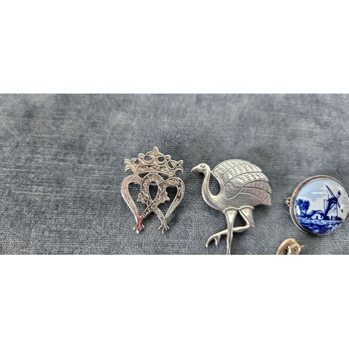 562 - 4 x Silver brooches including delft and birds