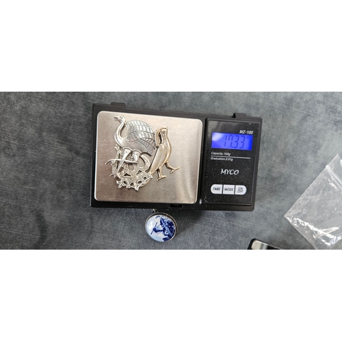 562 - 4 x Silver brooches including delft and birds