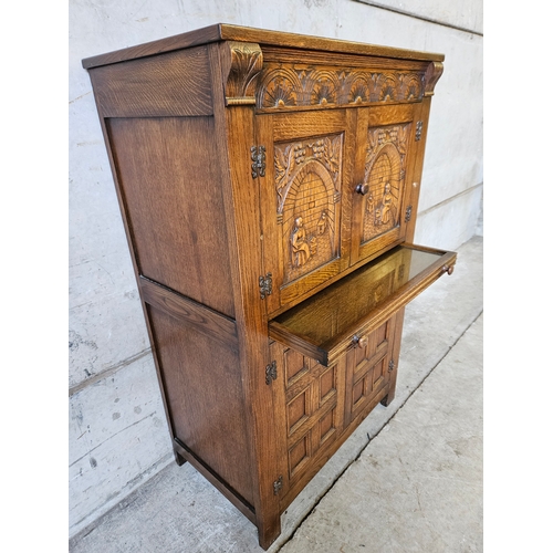 743 - Robinson & Sons Ltd, Hexham Carved Oak Cocktail Cabinet H125cm W80cm D46cm