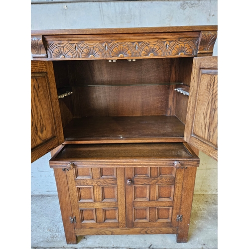 743 - Robinson & Sons Ltd, Hexham Carved Oak Cocktail Cabinet H125cm W80cm D46cm