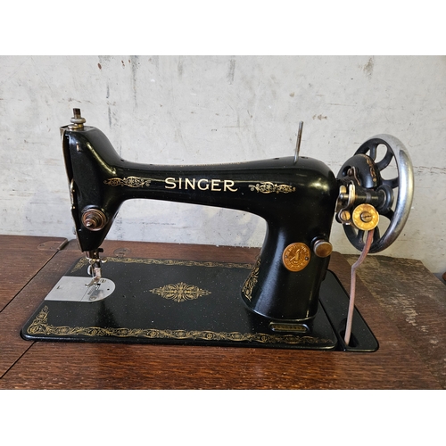 777 - 2 Oak Treadle Singer Sewing Machines