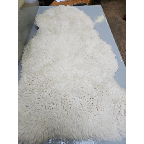 26 - 2 Small Sheepskin Rugs