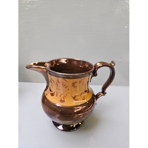 109 - Set Of 4 Copper Lustre Jugs