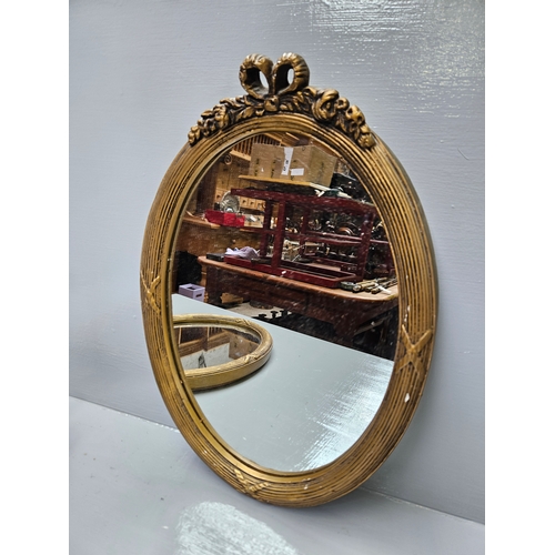 512 - A Pair Of Gilt Oval Mirrors H44cm