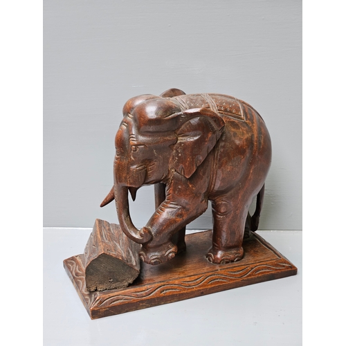 569 - Carved Wooden Elephant H27cm