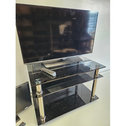 1157 - Samsung TV On Stand With Remote, Blaupunkt TV With Remote