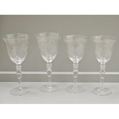 91 - A Suite Of 17 Etched Wine Glasses